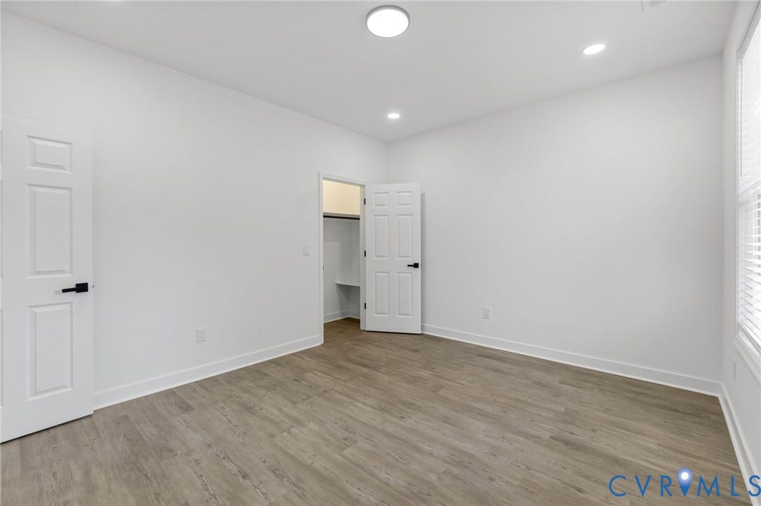 524 Cameron Street, Petersburg, VA 23803 Room featuring wood-finish flooring, white walls, and a window with blinds