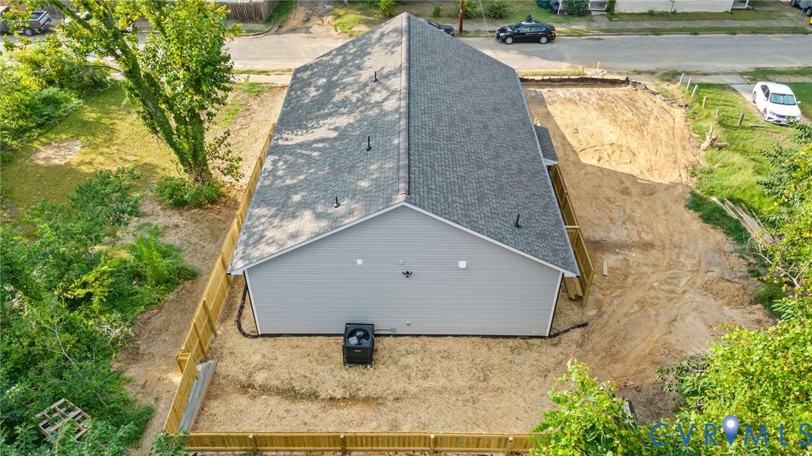 524 Cameron Street, Petersburg, VA 23803 Newly constructed residence featuring a gray exterior, dark shingle roof, and a wood privacy fence