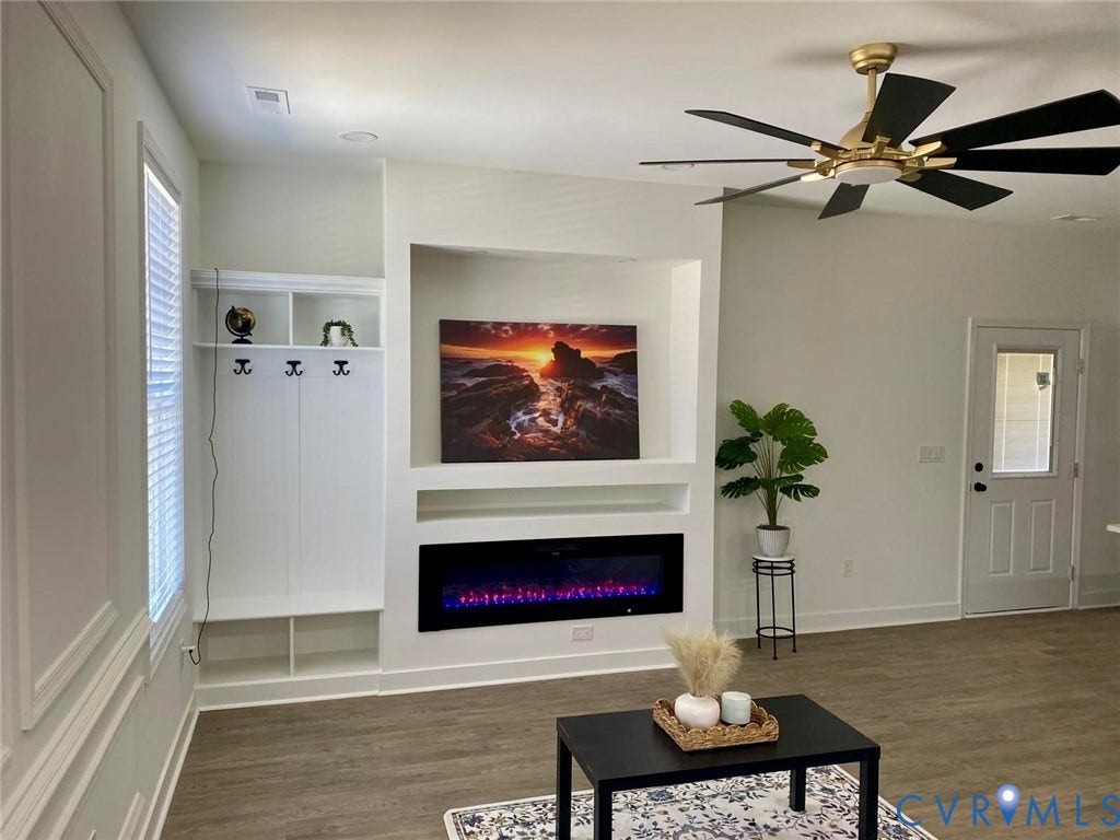 524 Cameron Street, Petersburg, VA 23803 Built-in storage with coat hooks, integrated electric fireplace, contemporary ceiling fan, and wood-finish flooring