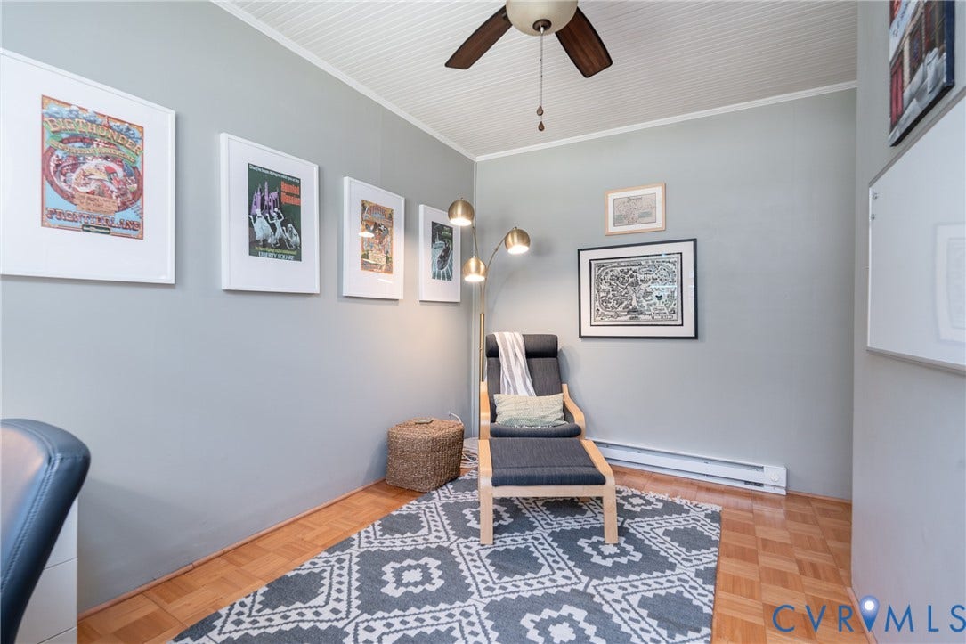 Wood-finish flooring, light grey walls, and a white beadboard ceiling