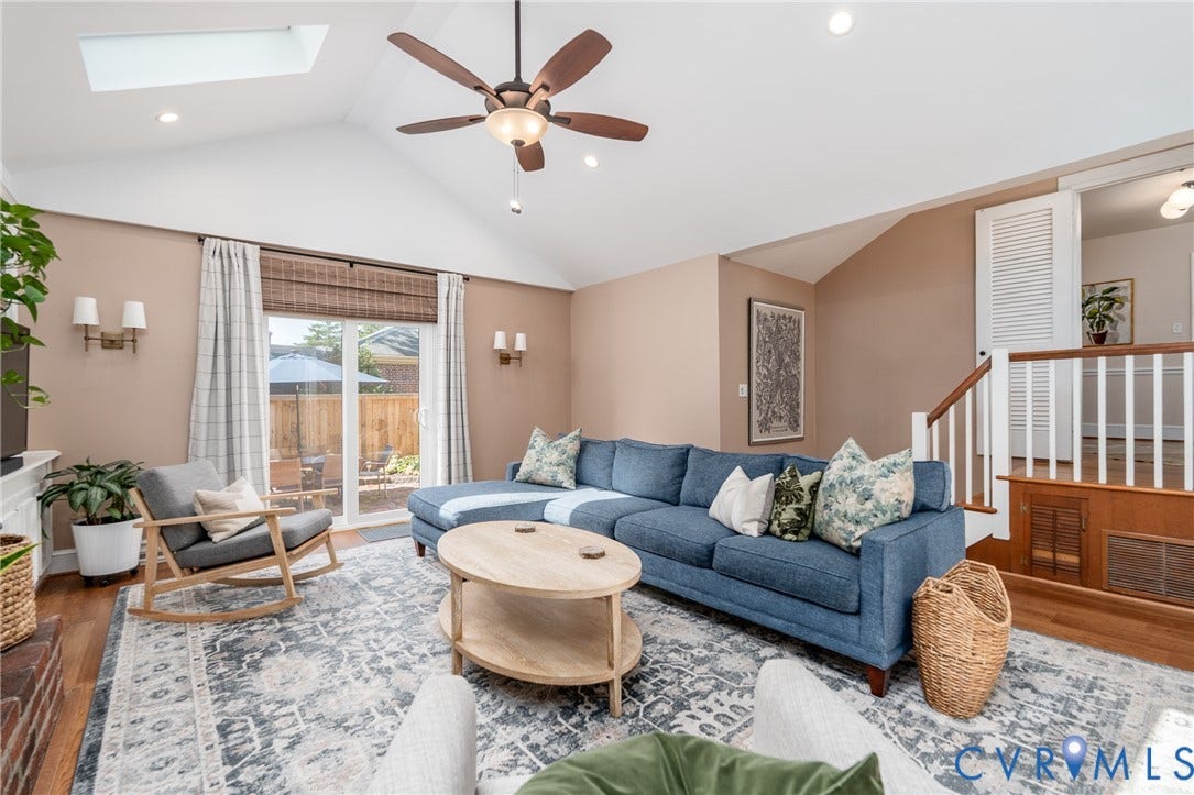 Vaulted ceiling with skylight, recessed lighting, and ceiling fan