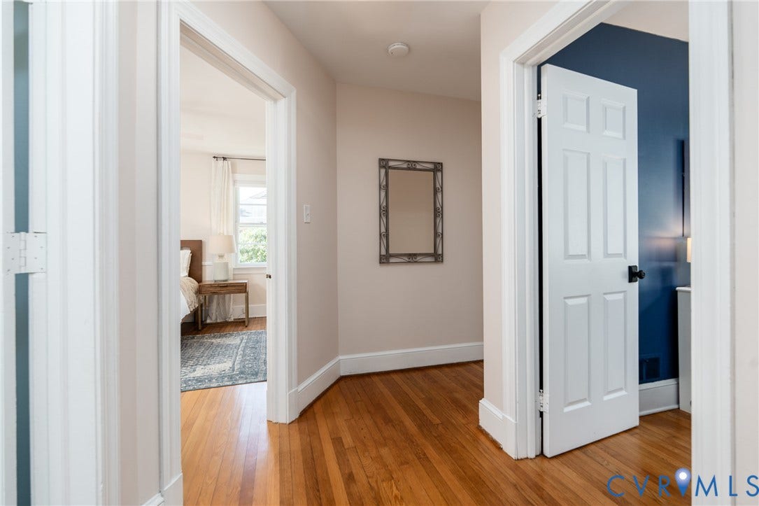 Hardwood flooring, painted interior doors, and crisp white trim