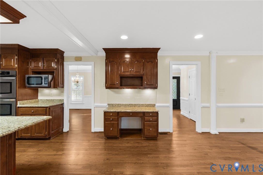 Stainless steel appliances and generous counter space complete this well-equipped kitchen.