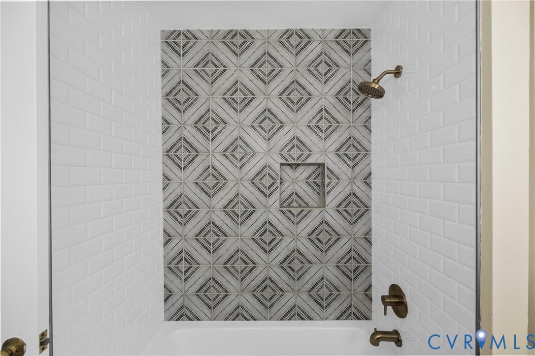 A tiled tub/shower combination completes this stylish hall bath.