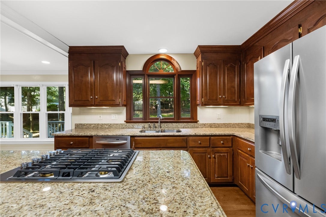 A center island and gas cooktop make this kitchen ideal for everyday cooking and entertaining.