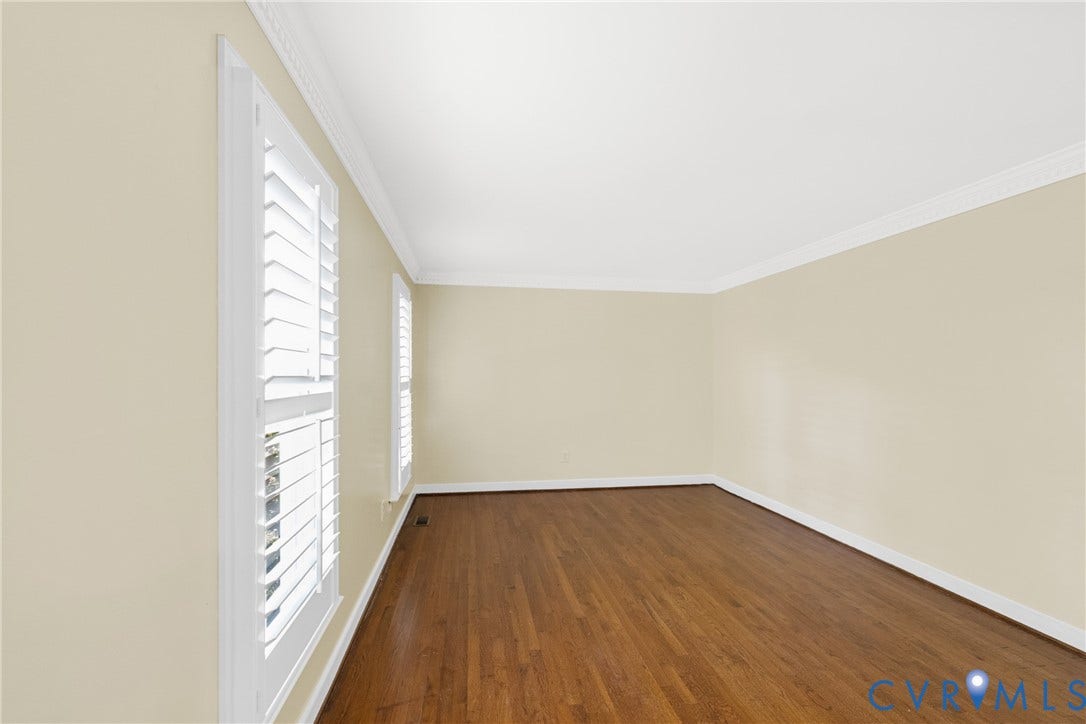 A versatile flex room offers space for a home office, sitting room, or additional living area.