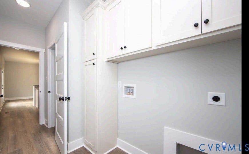 White shaker-style cabinetry with black hardware