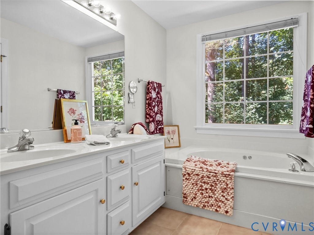 12000 Glen Kilchurn Drive, Chesterfield, VA 23838 Dual vanity with white cabinetry and gold-toned hardware