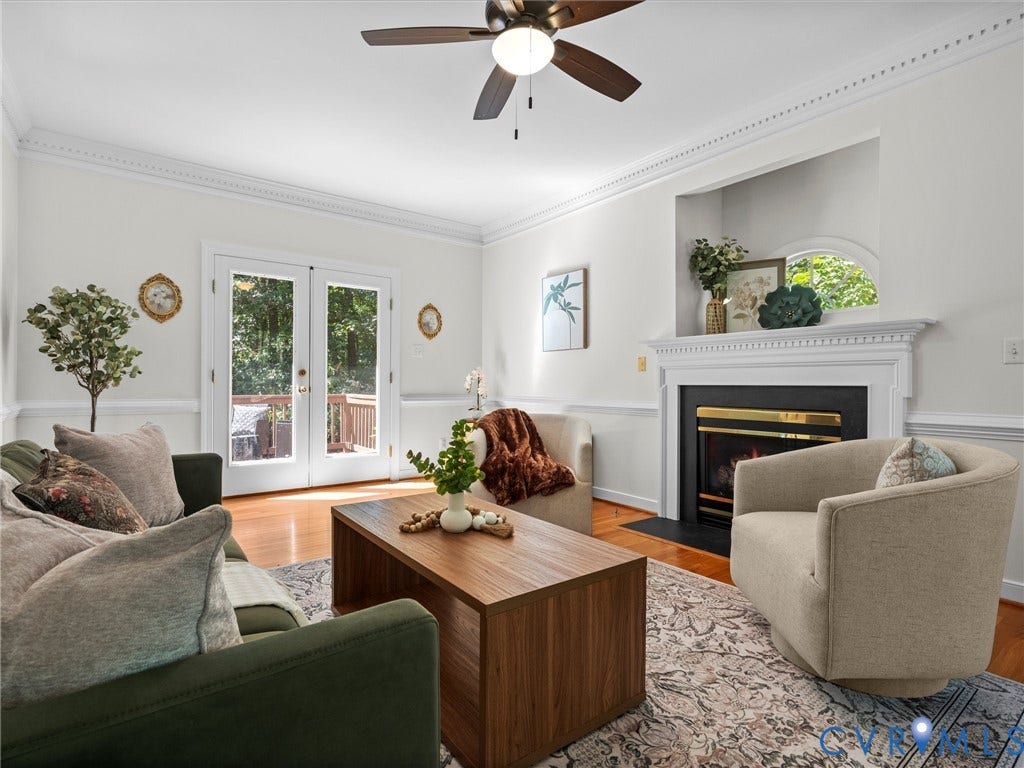 12000 Glen Kilchurn Drive, Chesterfield, VA 23838 Recessed fireplace with white mantel, French patio doors, wood-finish flooring, ceiling fan, and decorative crown molding