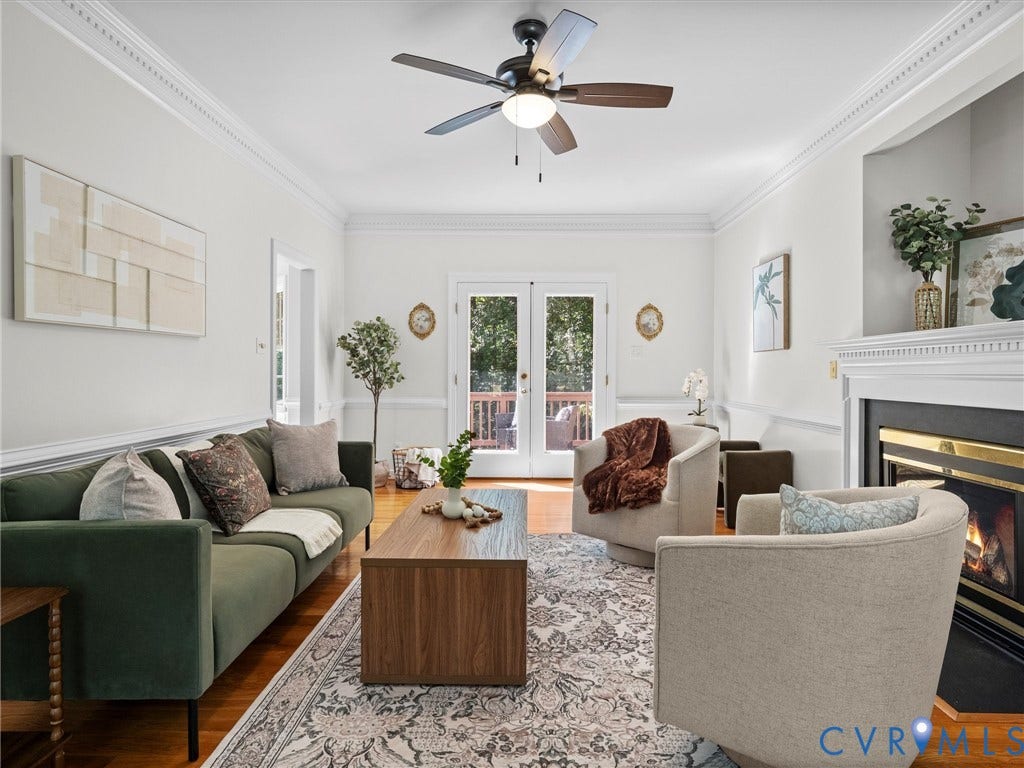 12000 Glen Kilchurn Drive, Chesterfield, VA 23838 Hardwood flooring, crown molding, built-in fireplace, ceiling fan with lighting, and French doors leading to exterior space