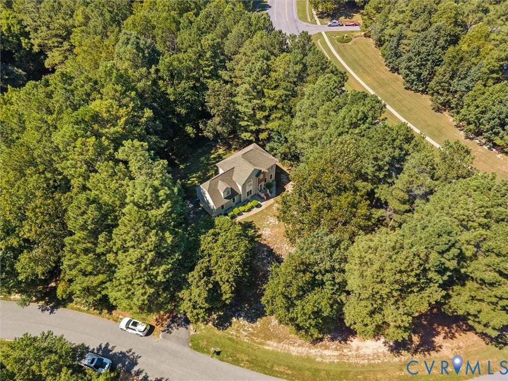 12000 Glen Kilchurn Drive, Chesterfield, VA 23838 Tree-lined property with a multi-story residence featuring a gabled roof and surrounding natural landscape