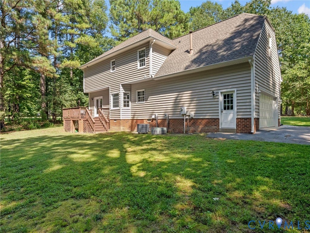 12000 Glen Kilchurn Drive, Chesterfield, VA 23838 Wooded lot with a multi-level deck, two-car garage, and a side entrance door