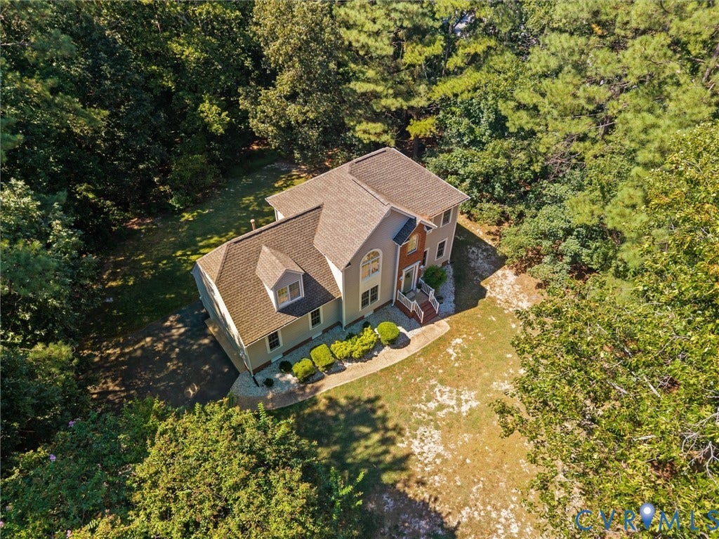 12000 Glen Kilchurn Drive, Chesterfield, VA 23838 Two-story residence with a dormer, arched window, and landscaped front entry