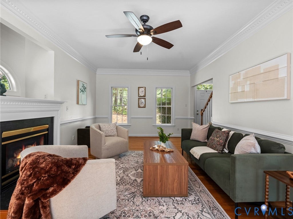 12000 Glen Kilchurn Drive, Chesterfield, VA 23838 Hardwood flooring, crown molding, chair rail molding, fireplace with a mantel, and a ceiling fan