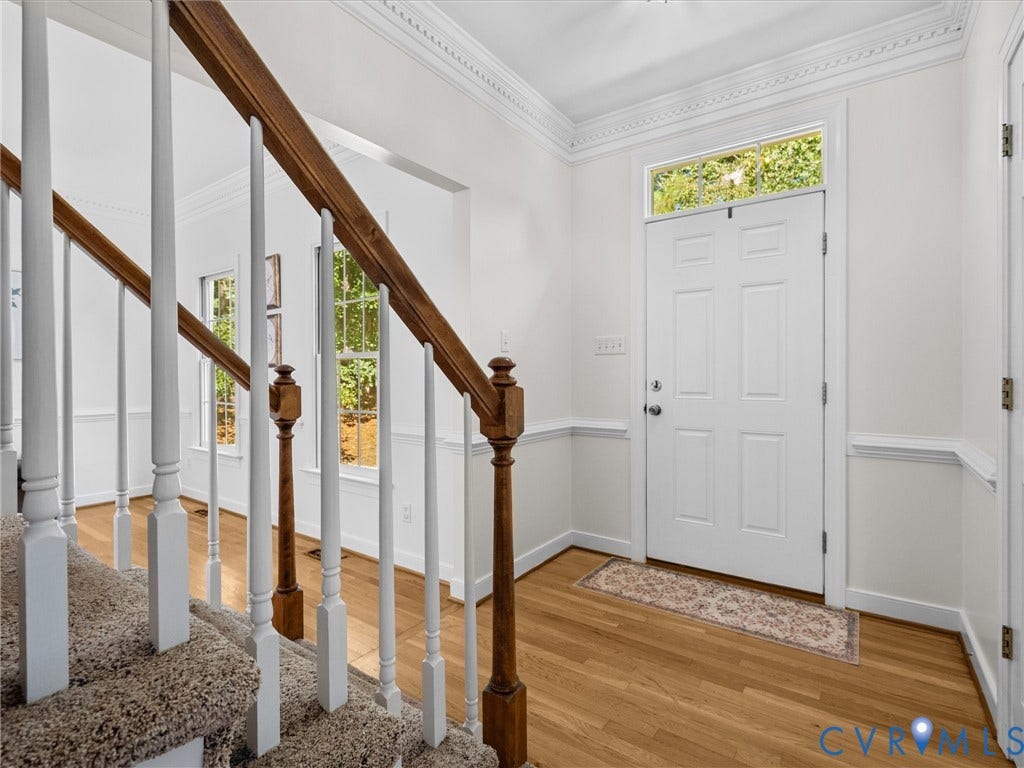 12000 Glen Kilchurn Drive, Chesterfield, VA 23838 Hardwood flooring, crown molding, chair rail molding, white panel front door, and a transom window