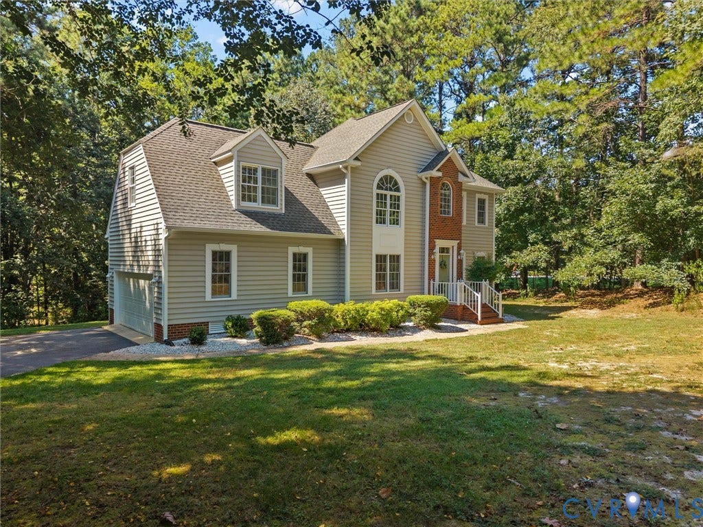 12000 Glen Kilchurn Drive, Chesterfield, VA 23838 Two-story residence featuring light-colored siding and a brick facade accent