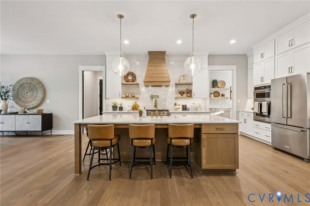 Lot 5 Olivet Church Road, Olivet Church Estates, New Kent, VA 23124 Gourmet kitchen featuring a large central island, white cabinetry, stainless steel appliances, and wood-finish flooring