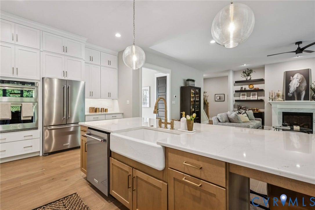Lot 5 Olivet Church Road, Olivet Church Estates, New Kent, VA 23124 Kitchen features white shaker cabinetry, stainless steel appliances, wood-finish flooring, and a large island with white countertops