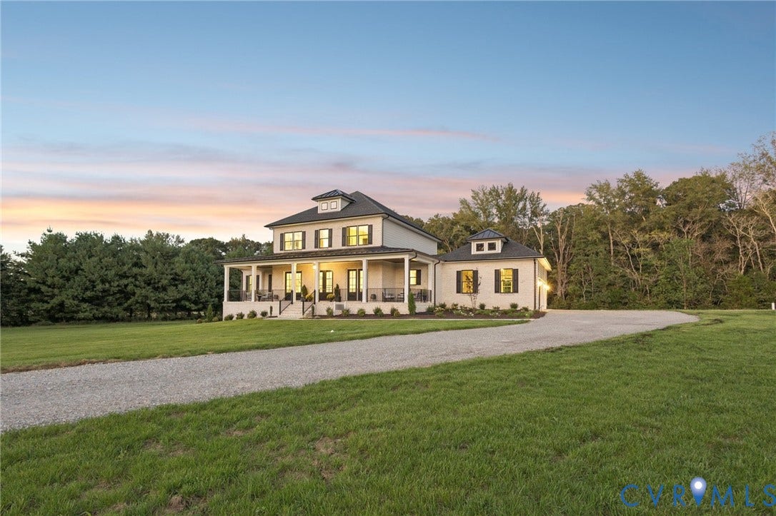 Lot 5 Olivet Church Road, Olivet Church Estates, New Kent, VA 23124 Spacious property featuring a gravel drive, expansive green lawn, and a two-story residence with a covered porch