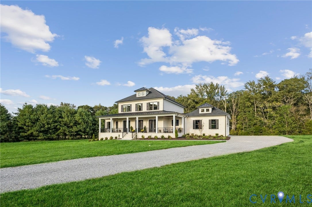 Lot 5 Olivet Church Road, Olivet Church Estates, New Kent, VA 23124 Two-story residence with a covered porch, dormer windows, and a gravel driveway