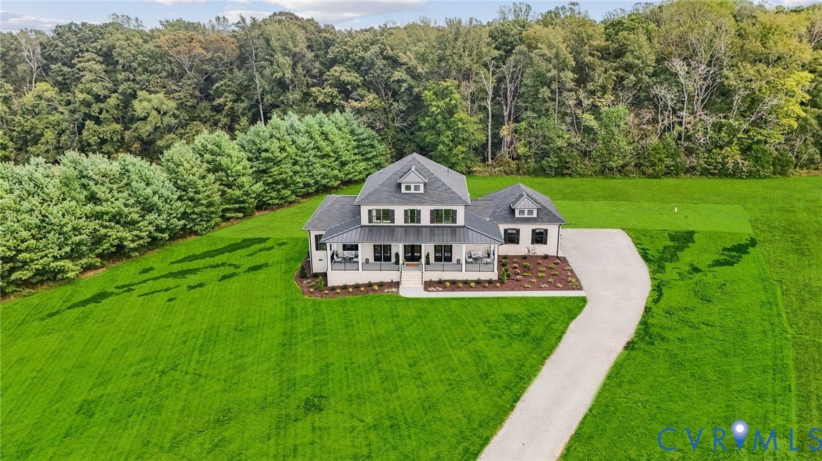 Lot 5 Olivet Church Road, Olivet Church Estates, New Kent, VA 23124 Expansive green lawn, mature trees, long driveway, and a welcoming front porch