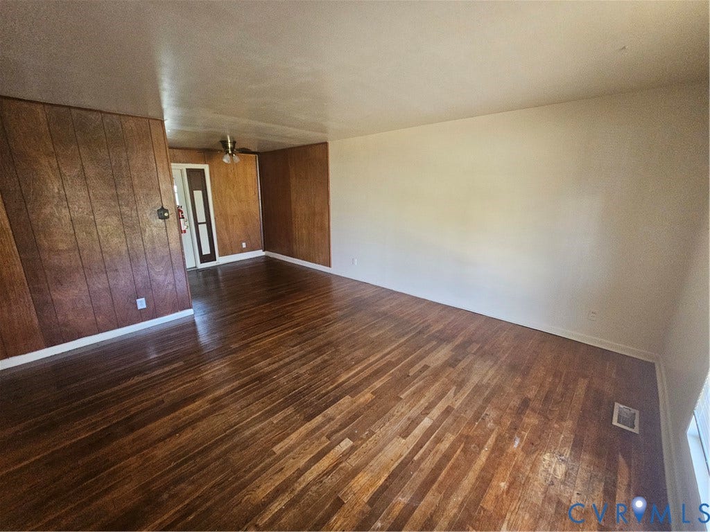 1210 W Leigh Street, Richmond, VA 23220 Wood-finish flooring throughout, complemented by wood paneling on accent walls