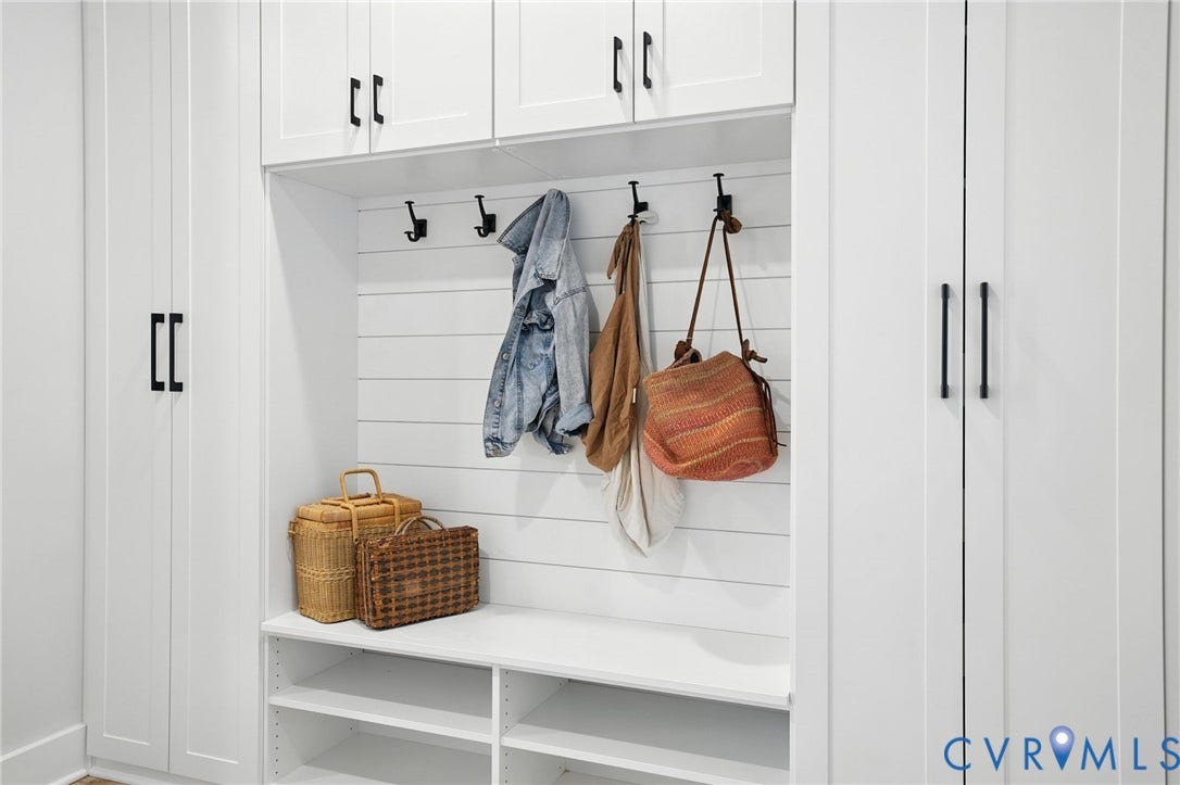 Lot 1 Needlewood Court, Olivet Church Estates, New Kent, VA 23124 White built-in cabinetry with black hardware, integrated bench seating, and wall-mounted hooks