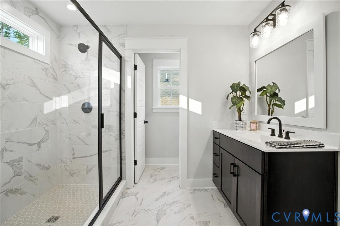Lot 1 Needlewood Court, Olivet Church Estates, New Kent, VA 23124 Spacious bathroom featuring a glass-enclosed shower with honeycomb tile flooring and marble-look wall tiling