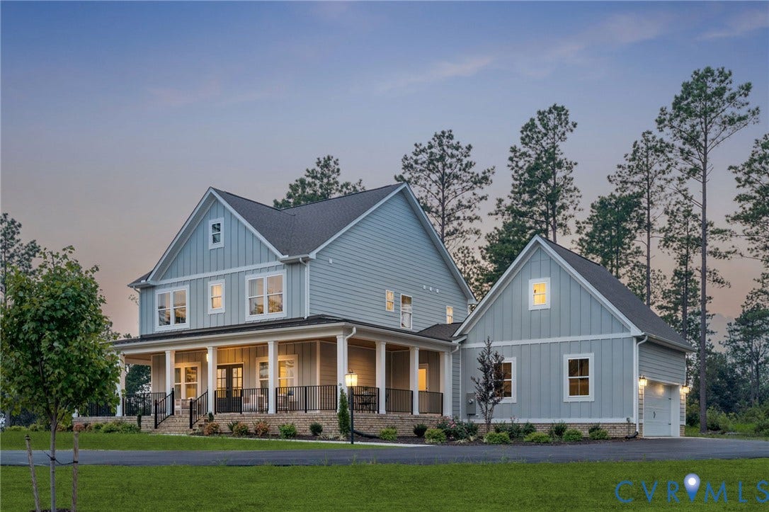 Lot 1 Needlewood Court, Olivet Church Estates, New Kent, VA 23124 Two-story residence featuring light blue siding, a covered wraparound porch with black railings, and a two-car garage
