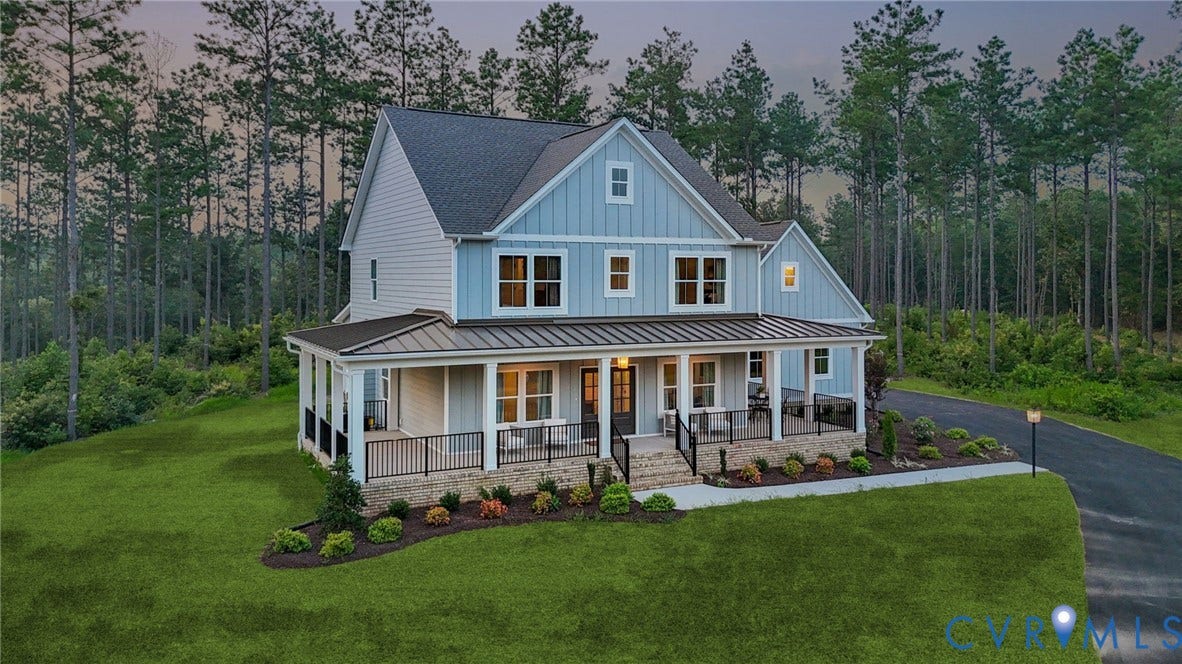 Lot 1 Needlewood Court, Olivet Church Estates, New Kent, VA 23124 Two-story residence featuring light blue siding, a covered wrap-around porch with dark railings, a dark shingled roof, and a paved driveway
