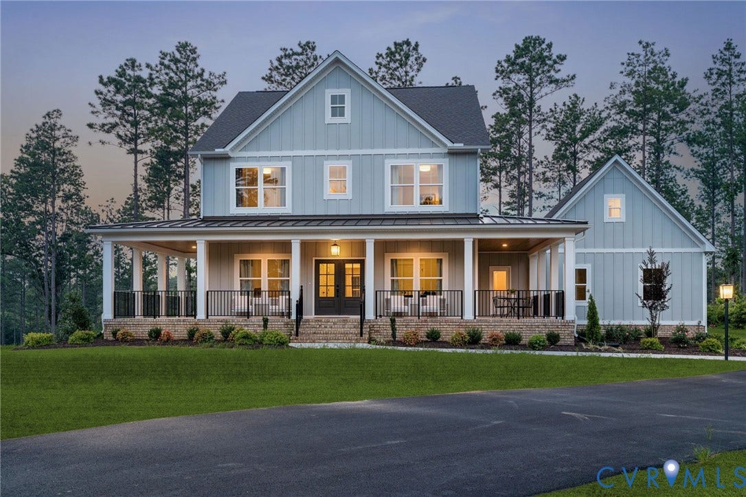 Lot 1 Needlewood Court, Olivet Church Estates, New Kent, VA 23124 Two-story residence featuring light blue vertical siding, a full-width covered porch with white columns and black railings, and a dark asphalt driveway