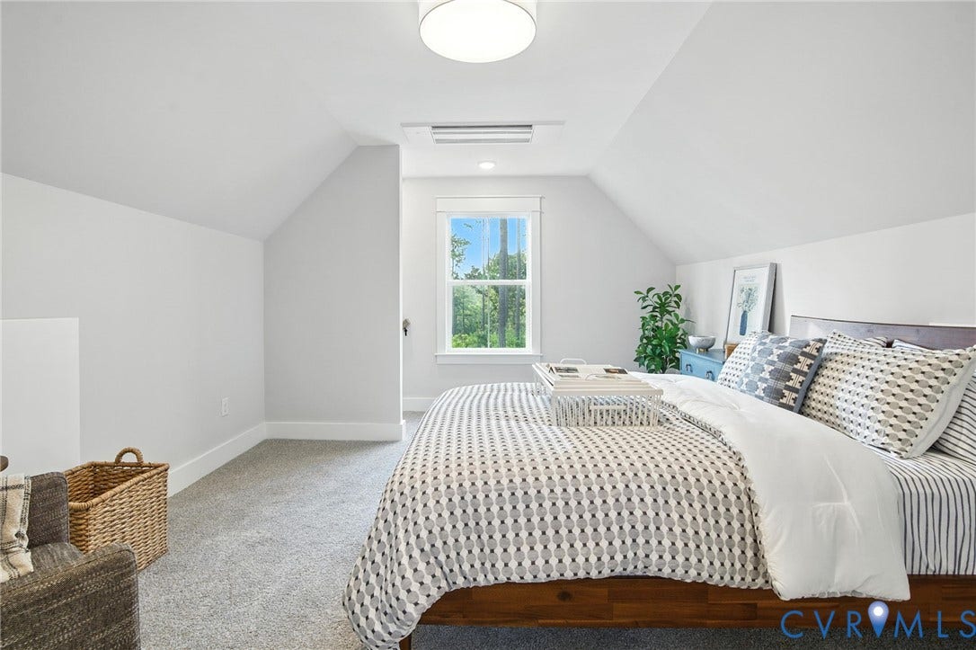 Lot 1 Needlewood Court, Olivet Church Estates, New Kent, VA 23124 Window with white trim, wood-finish bed frame, light gray carpet, sloped ceiling, and flush mount ceiling light