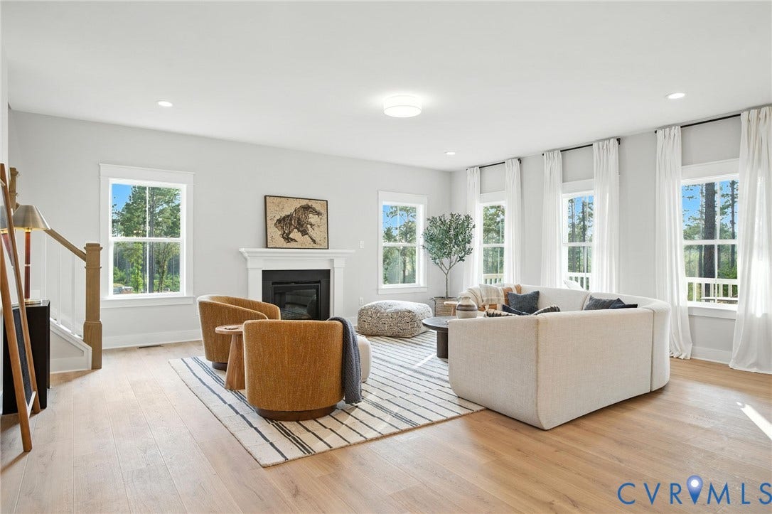Lot 1 Needlewood Court, Olivet Church Estates, New Kent, VA 23124 Spacious living area featuring wood-finish flooring, a fireplace with a mantel, multiple windows, and recessed lighting
