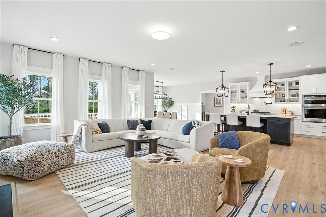 Lot 1 Needlewood Court, Olivet Church Estates, New Kent, VA 23124 Spacious open-concept living area featuring light wood-finish flooring, recessed lighting, and multiple windows