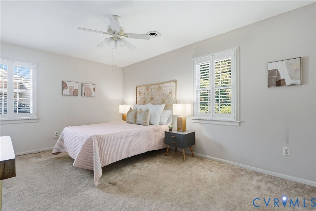 4810 Conduit Road, Colonial Heights, VA 23834 Neutral-toned walls, two windows with plantation shutters, ceiling fan with integrated lighting, and wall-to-wall carpeting