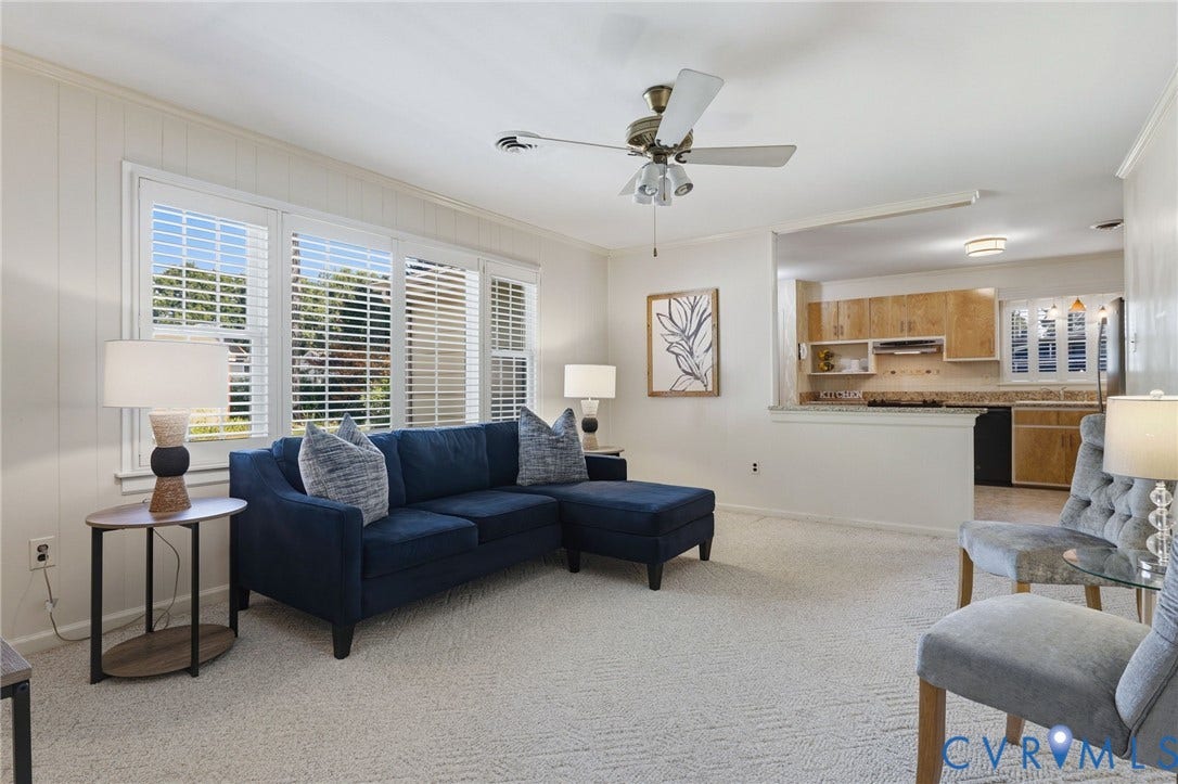 4810 Conduit Road, Colonial Heights, VA 23834 Living area with wall-to-wall carpeting and white paneling