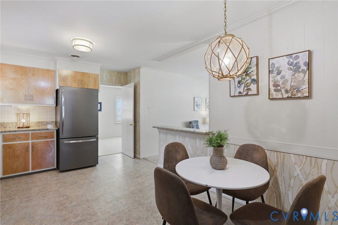 4810 Conduit Road, Colonial Heights, VA 23834 Wood-finish cabinetry with granite countertops, stainless steel refrigerator, and recessed lighting