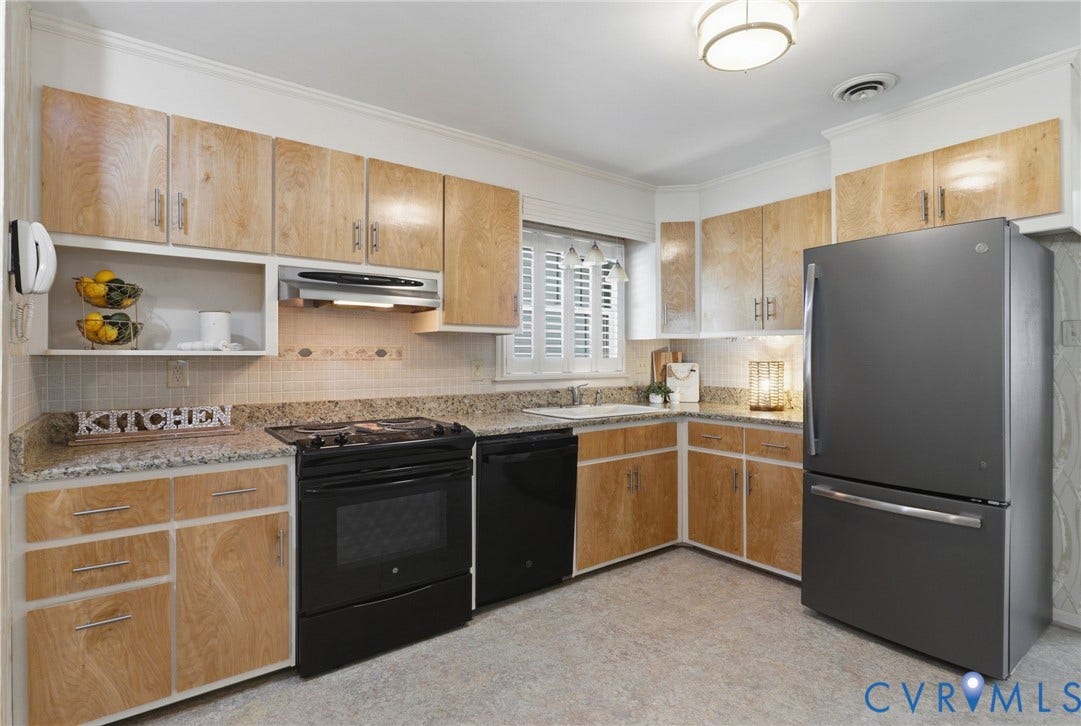 4810 Conduit Road, Colonial Heights, VA 23834 Kitchen featuring light wood-finish cabinetry, speckled countertops, stainless steel sink, and black appliances