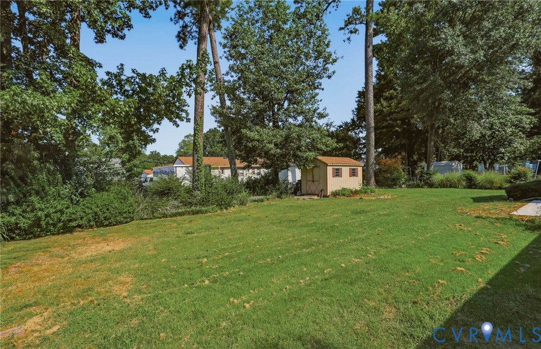 4810 Conduit Road, Colonial Heights, VA 23834 Expansive grassy yard with mature trees and a detached shed