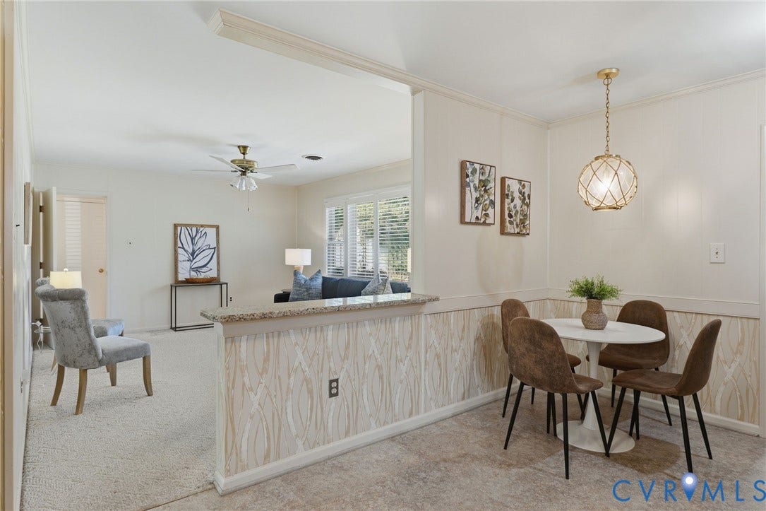 4810 Conduit Road, Colonial Heights, VA 23834 Built-in half wall with granite countertop, wood-finish paneling, and a contemporary spherical pendant light fixture