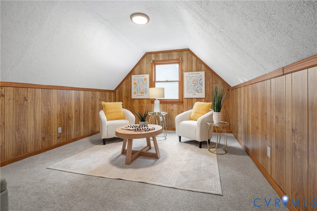 4525 Old Mesa Drive, North Chesterfield, VA 23237 Attic space featuring wood-finish paneling, a single window with blinds, and recessed lighting