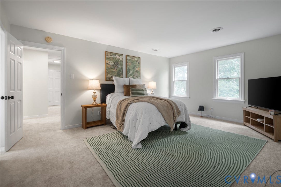 4525 Old Mesa Drive, North Chesterfield, VA 23237 Neutral wall paint, two white-trimmed windows, light-colored carpeting, and a built-in ceiling light