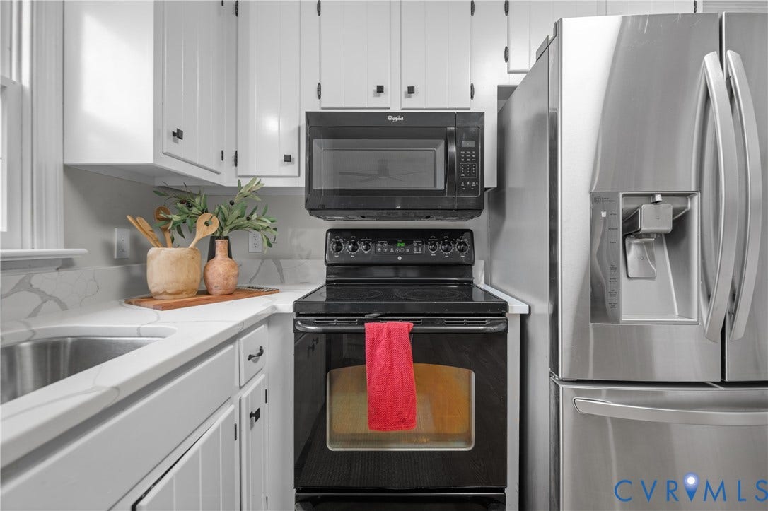 4525 Old Mesa Drive, North Chesterfield, VA 23237 White cabinetry with black hardware, stainless steel appliances, white countertops, stainless steel sink, and black electric range