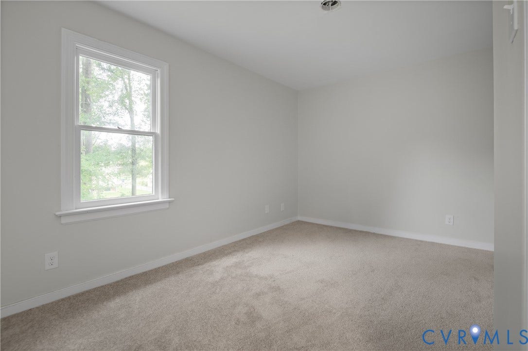 4525 Old Mesa Drive, North Chesterfield, VA 23237 Light-colored carpeting, white wall paint, and a single window with white trim