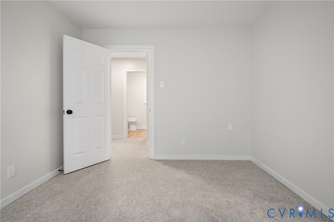 4525 Old Mesa Drive, North Chesterfield, VA 23237 Neutral tone wall finish with light-colored carpet flooring