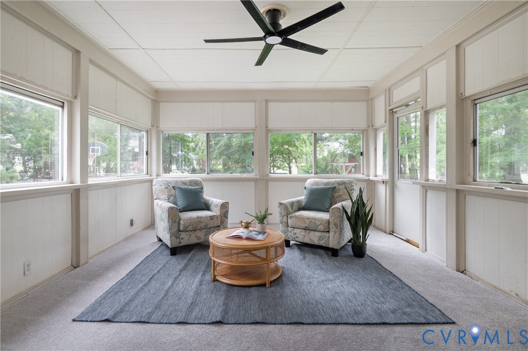 4525 Old Mesa Drive, North Chesterfield, VA 23237 Screened porch with extensive window panels, white paneling, and a ceiling fan