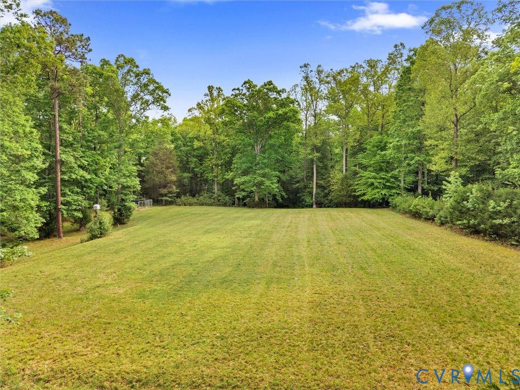 1700 Tigers Road, Manakin Sabot, VA 23103 There is an fenced apiary in the back corner that may convey.