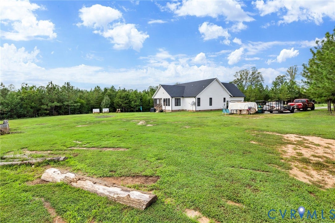 2927 Poorhouse Road, 522 Corridor, Goochland, VA 23063 Expansive grassy property with a white exterior residence and a dark roof
