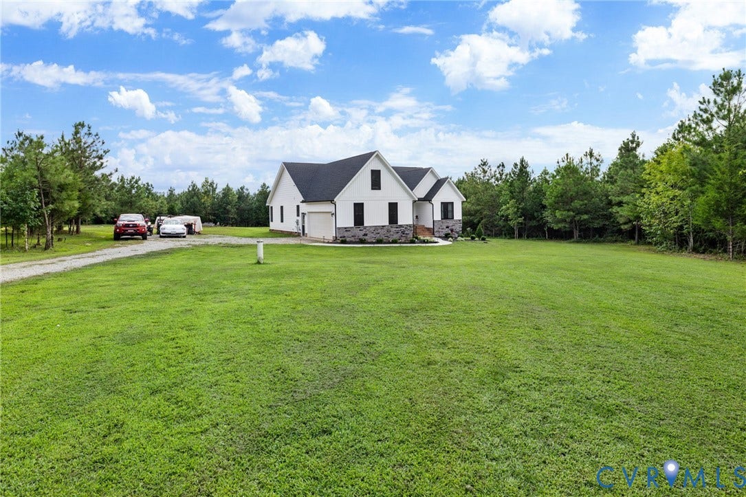 2927 Poorhouse Road, 522 Corridor, Goochland, VA 23063 Modern farmhouse-style exterior with black trim windows, a dark roof, and a stone facade accent