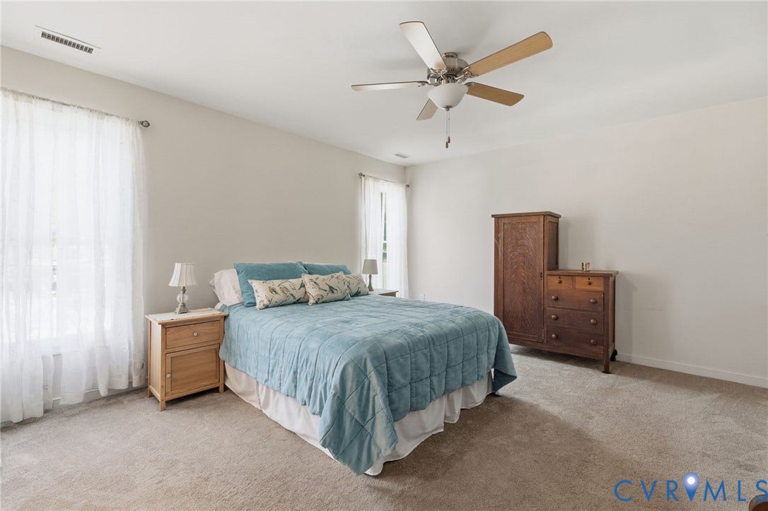 2927 Poorhouse Road, 522 Corridor, Goochland, VA 23063 Neutral wall paint, ceiling fan, and light-colored carpeting